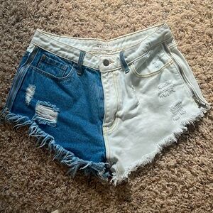Nature denim | Frayed half and half blue and white shorts with zippers